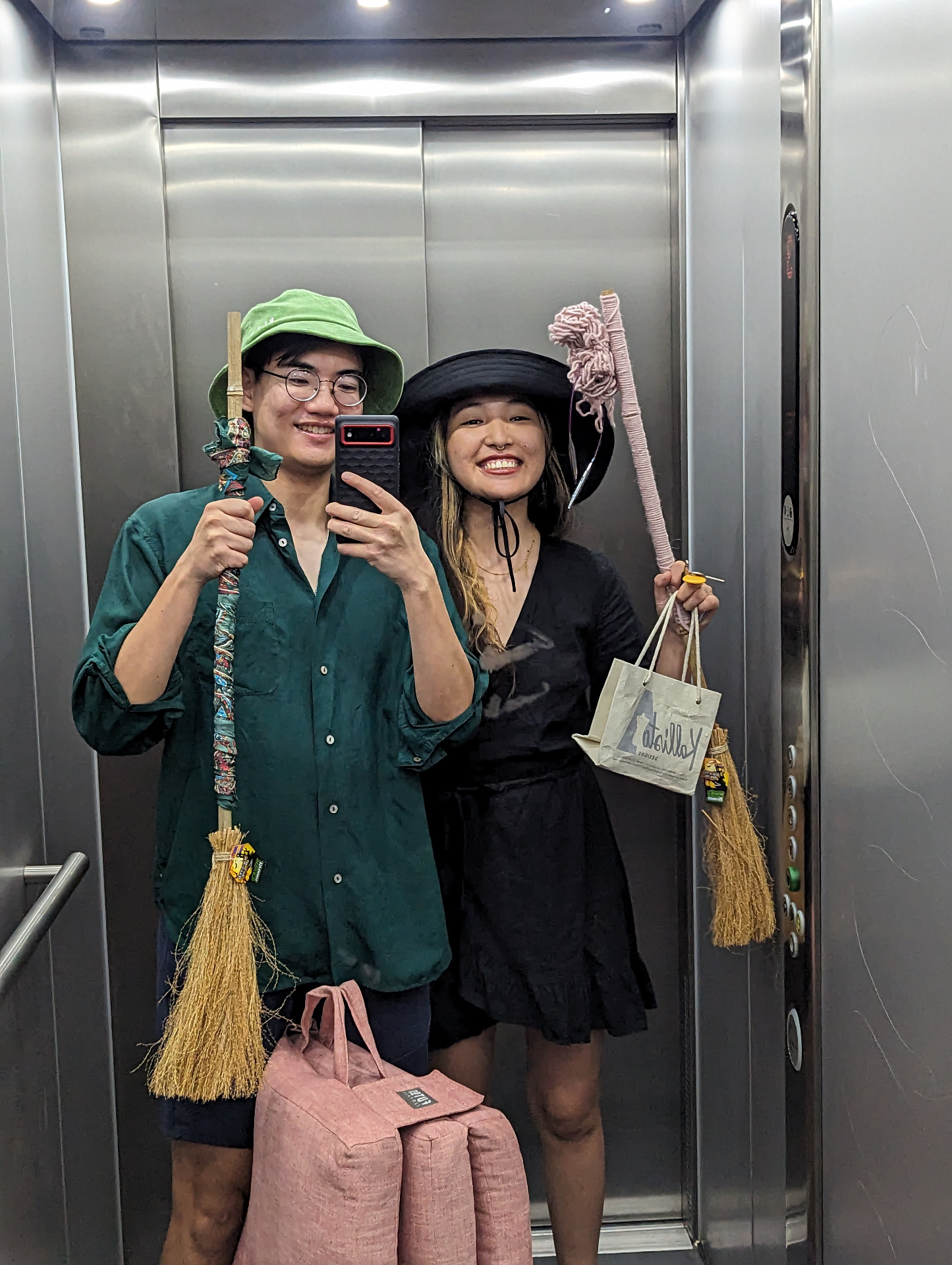 Mat and partner in witch costumes in an elevator