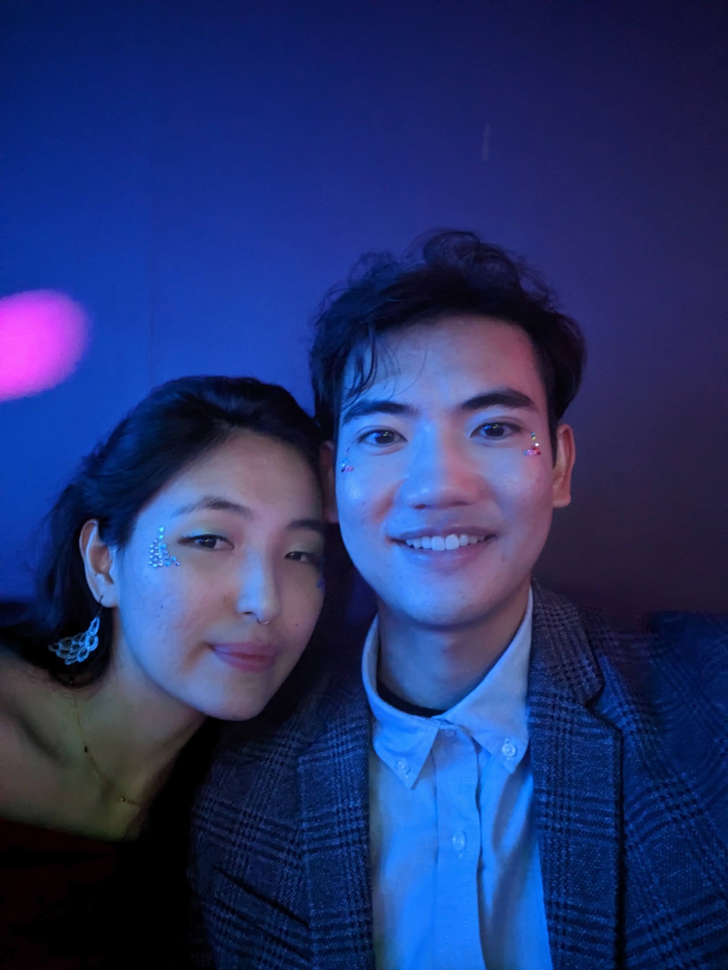 Mat and partner at a party with face gems