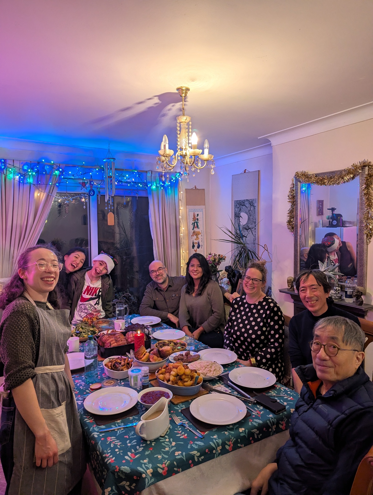 Mat with family around a festive dinner table
